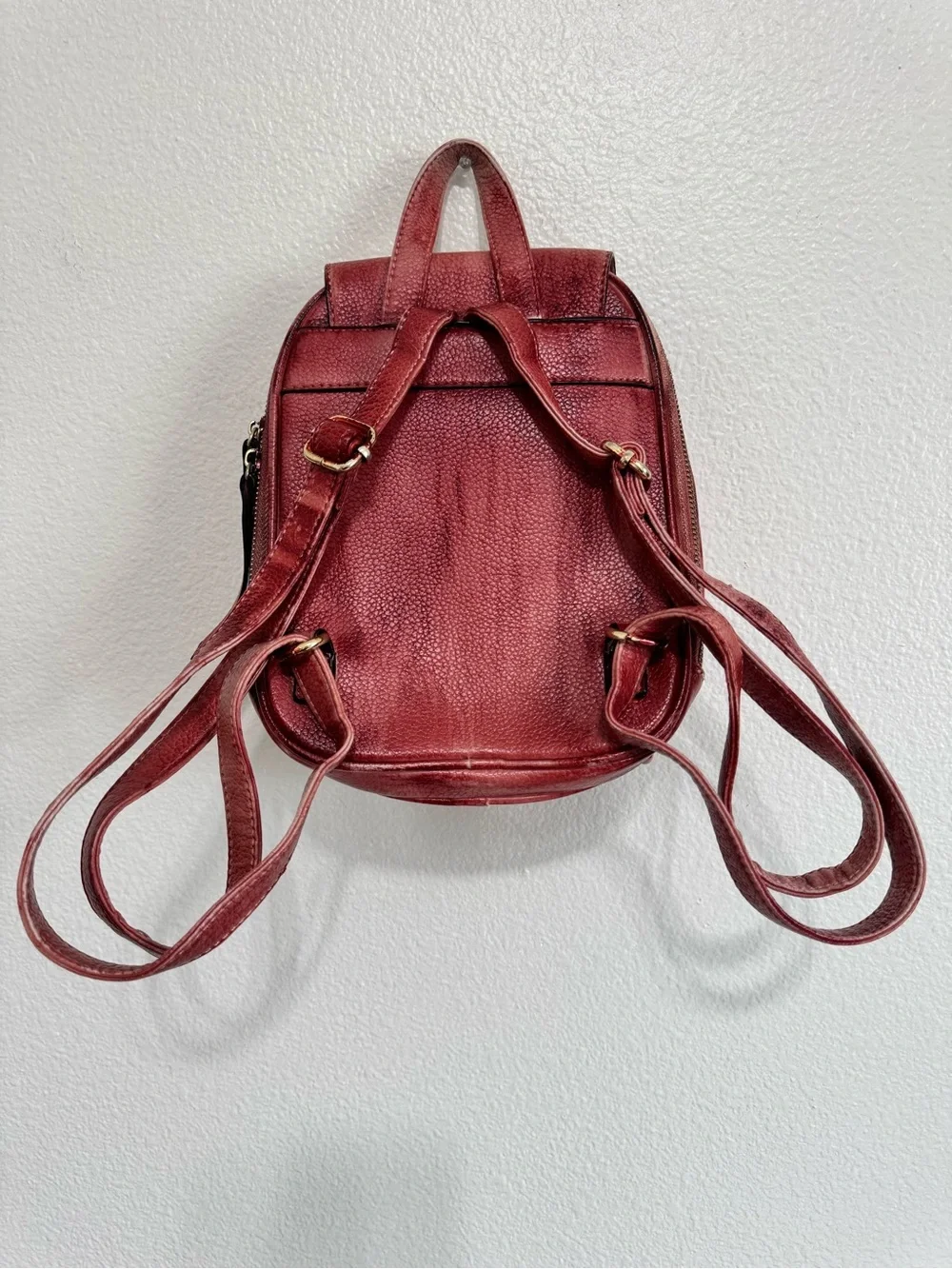 Distressed Circle Backpack With Red Flower lock Accent